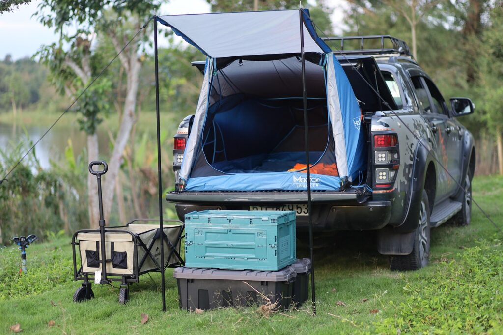 A camper smoothly clipping fiberglass tent poles into a color-coded modern dome tent.